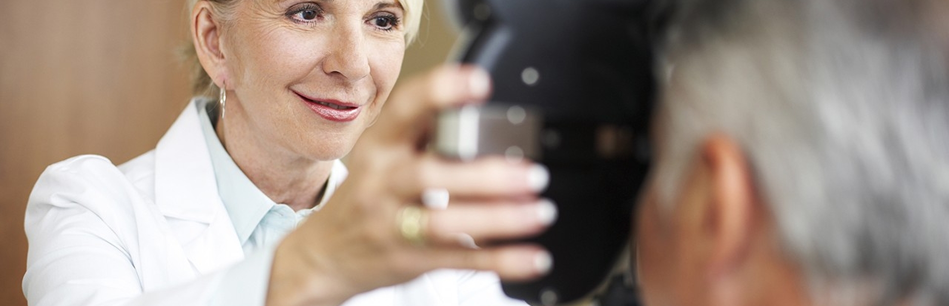 Doctor giving an eye exam