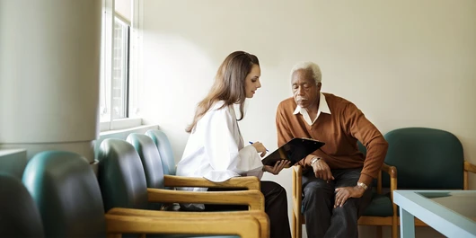 A doctor talks to a heart patient