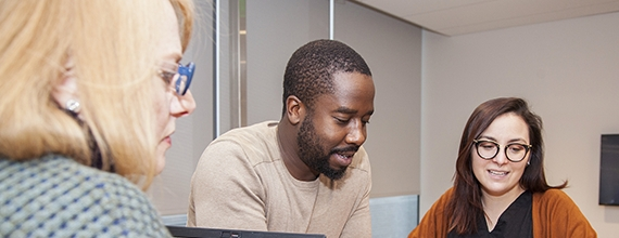 A group of three Novartis associates in a meeting