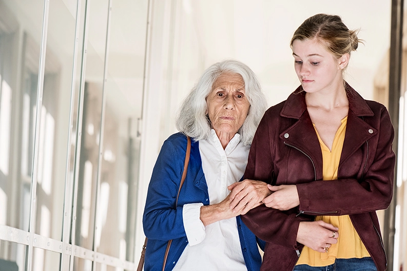 Grandmother with kidney failure and her granddaughter go for a walk